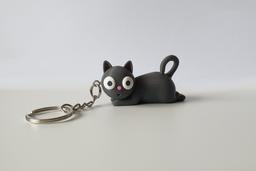 Tiny Chaos Cat 3D-printed PETG keychain, front view on white background