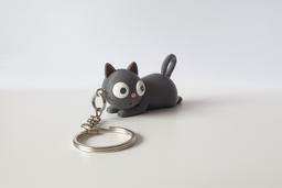 Tiny Chaos Cat 3D-printed PETG keychain, angled side view showing rounded body and curled tail